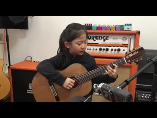 six-year-old girl performs "fly me to the moon" on the guitar